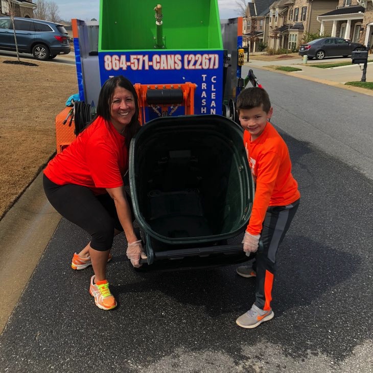Owner and son showing clean trash can